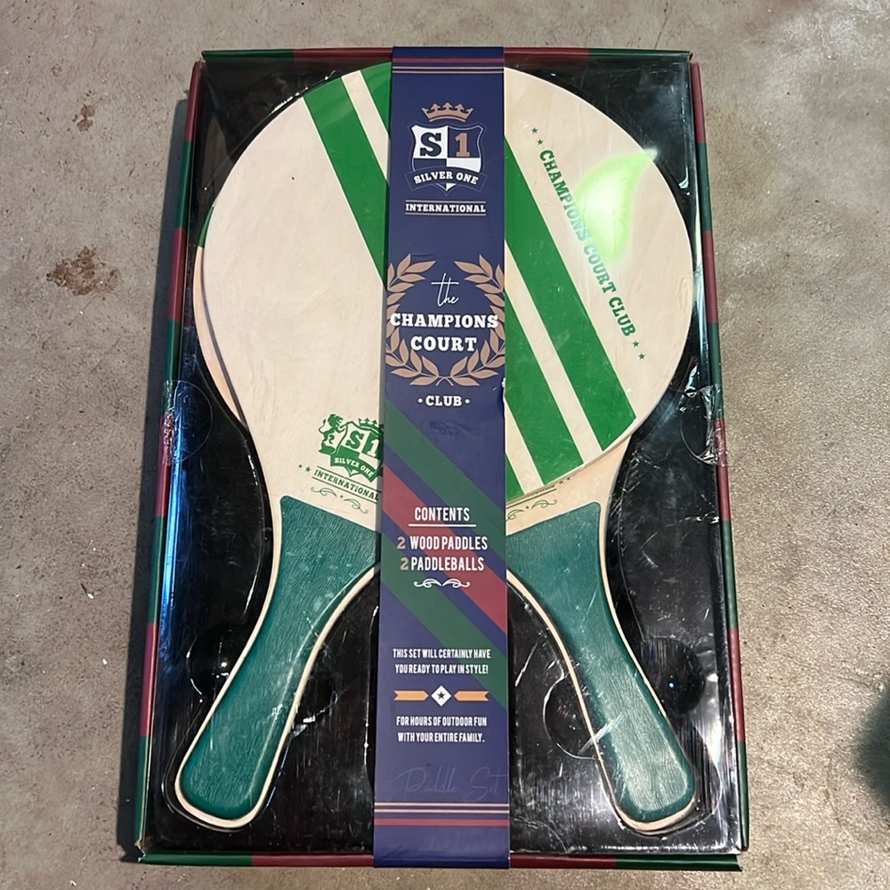 2 wood paddles+2paddleballs. New never used